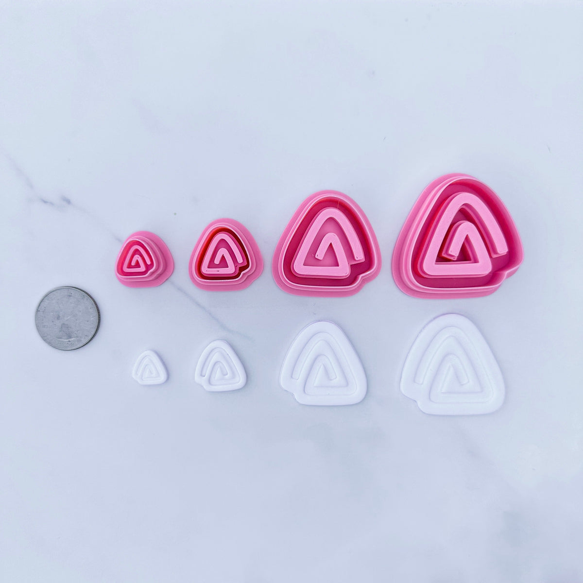 Triangular Swirls Cutters, coin used for scale